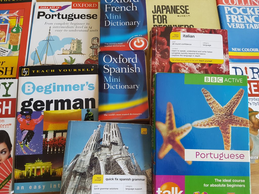 How can you learn a language effectively for travel?
