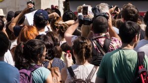 big group of tourists taking pictures